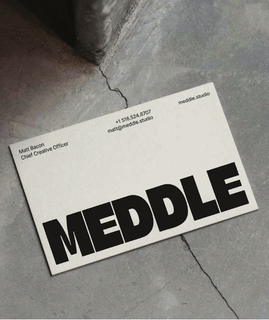 Business card across a crack in concrete